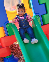 A child on a slide
AI-generated content may be incorrect.